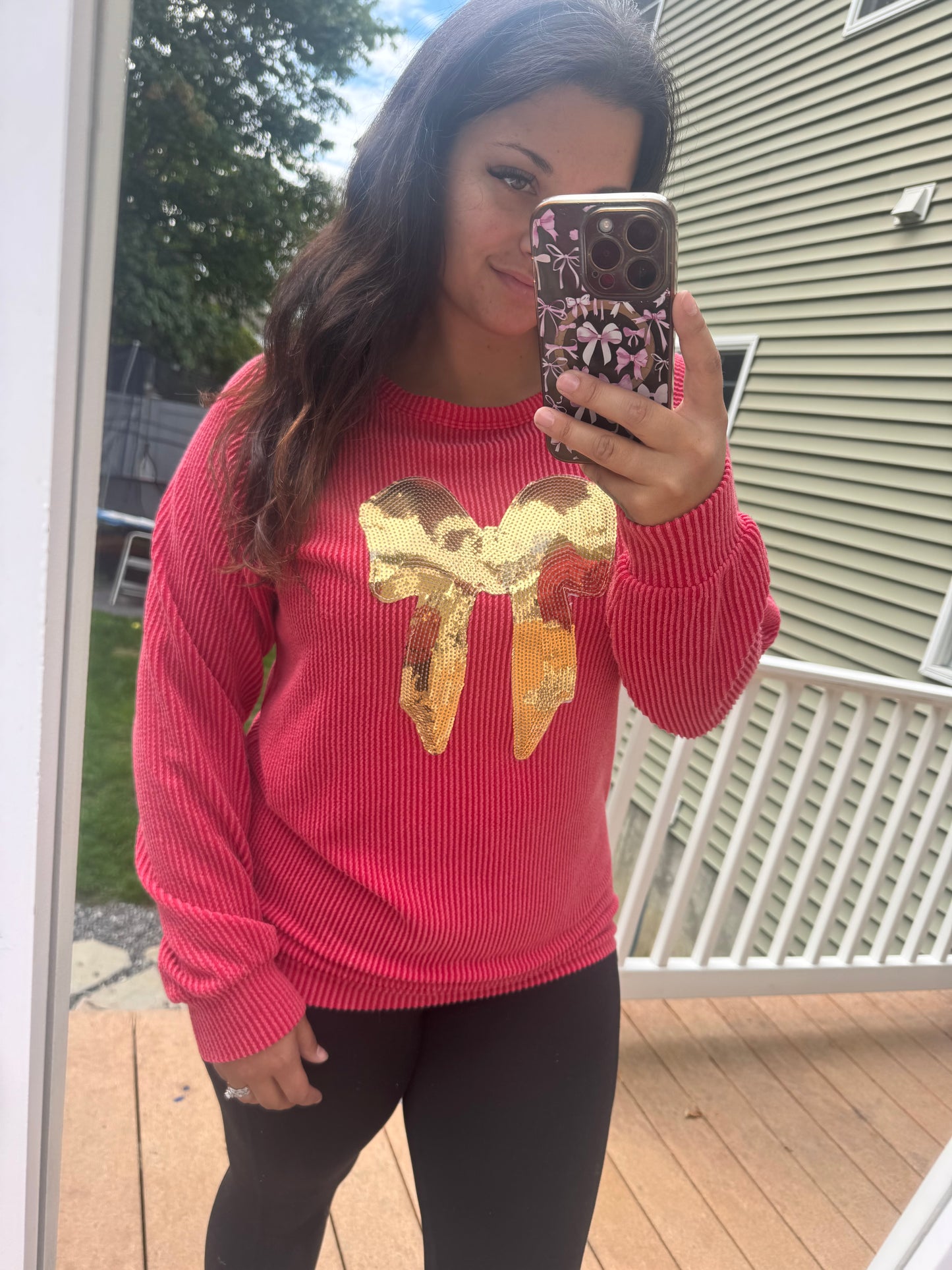Red ribbed sequin bow top