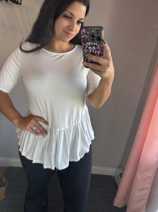 White ruffle hem top